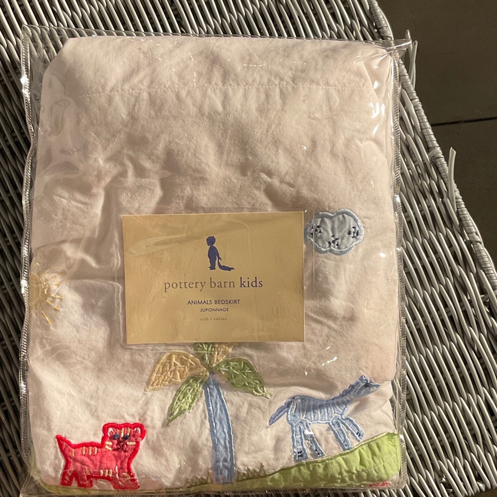 Pottery Barn Kids Animal Embroidered Bedskirt White with multicolored design.
